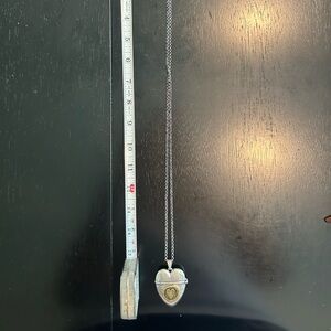 17” gold and silver heart necklace with hidden compartment